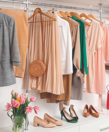 Modern wardrobe with stylish spring clothes and accessories